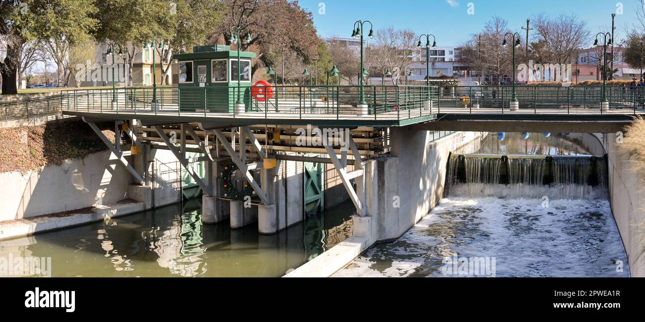 San Antonio, Texas, USA - February 2023: Panoramic view of the entrance to the boat lock on the river which runs through the centre of the city Stock Photo