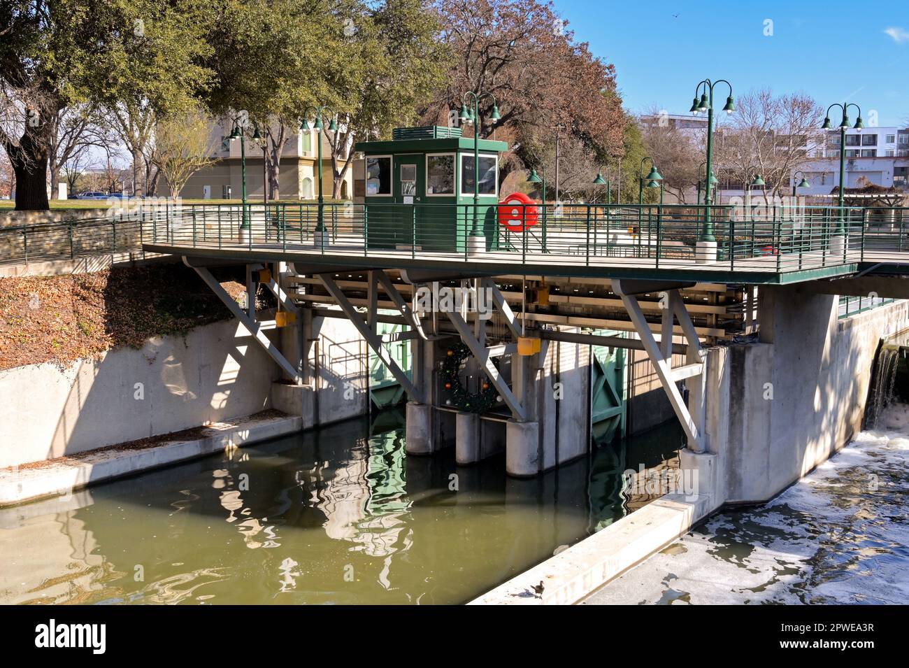 San Antonio, Texas, USA - February 2023: Entrance to the boat lock on the river which runs through the centre of the city Stock Photo