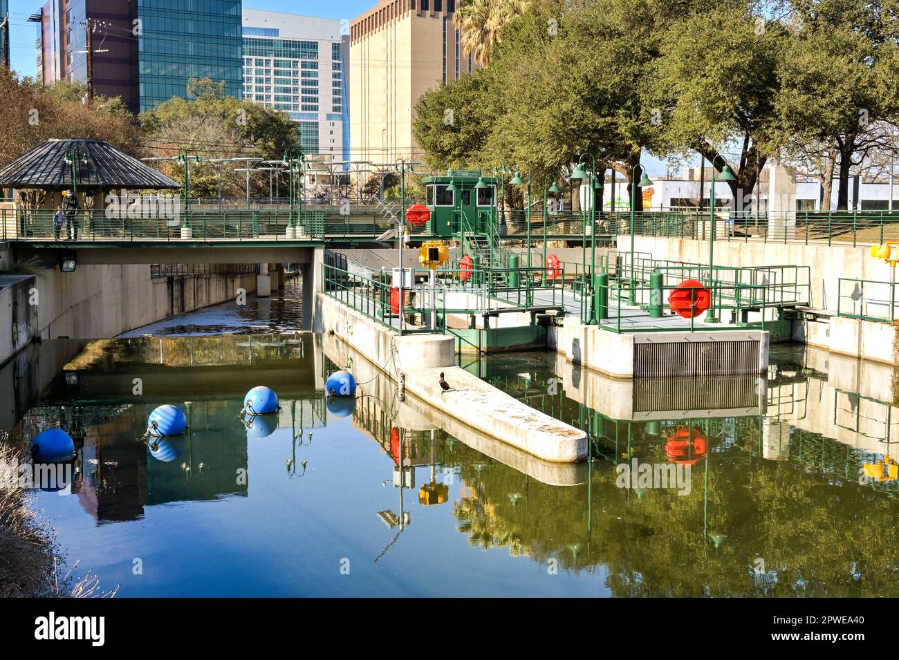 San Antonio, Texas, USA - February 2023: Entrance to the boat lock on the river which runs through the centre of the city Stock Photo