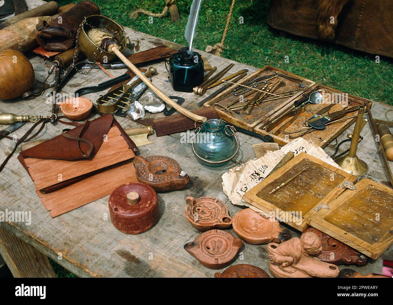 Ermine Street Guard Roman display. Items of everyday life; wax writing tablets, medical kit, oil lamps, stridgle. Stock Photo
