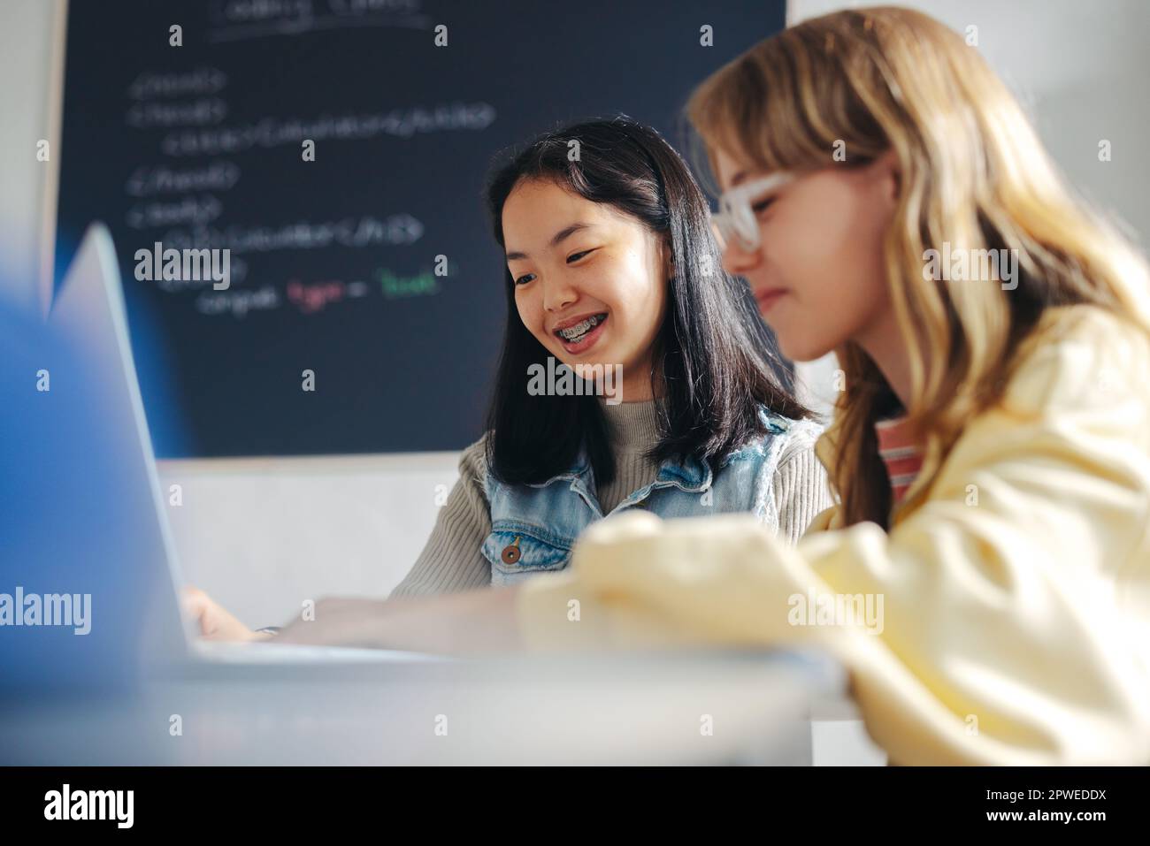 Female Students Working Collaboratively In A Coding Class To Learn Female Students Working Collaboratively In A Coding Class To Learn