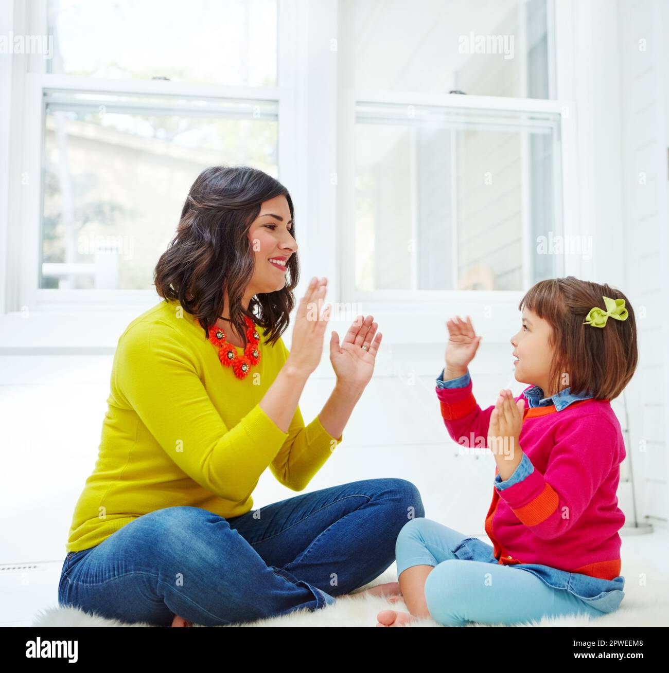 Pat a cake pat a cake an adorable little girl playing a clapping game