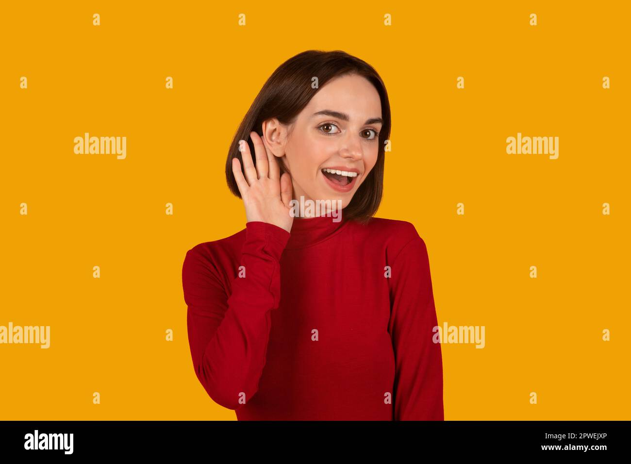 Excited young caucasian curious fun nosy woman eavesdrop Stock