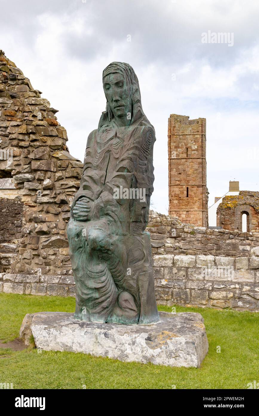 The modernday statue of St Cuthbert in the grounds of Lindisfarne