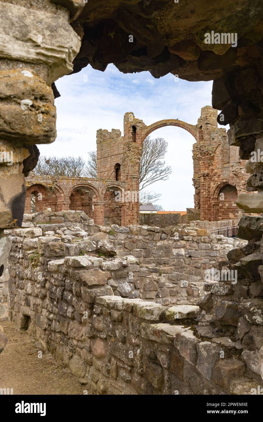 Lindisfarne Priory; 7th century monastery associated with St Cuthbert and early christianity, on Lindisfarne or Holy Island Northumberland UK Stock Photo