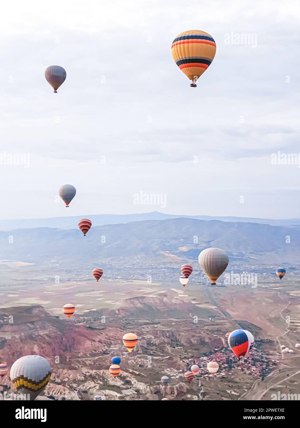 Process of launching many colored beautiful balloons into air in
