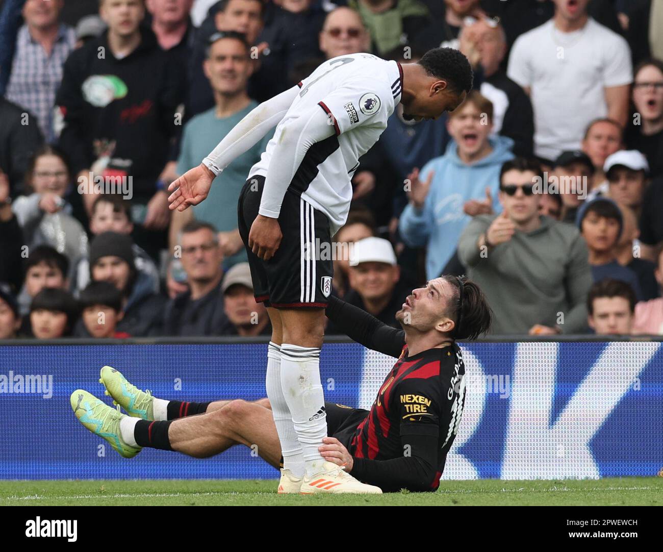 London, UK. 30th Apr, 2023. Jack Grealish of Manchester City and Kenny Tete of Fulham exchange words during the Premier League match at Craven Cottage, London. Picture credit should read: David Klein/Sportimage Credit: Sportimage Ltd/Alamy Live News Stock Photo