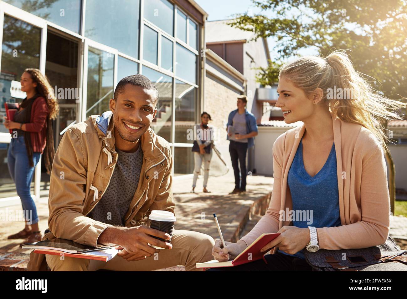 Preparing for exams together. two students studying together on campus. Stock Photo