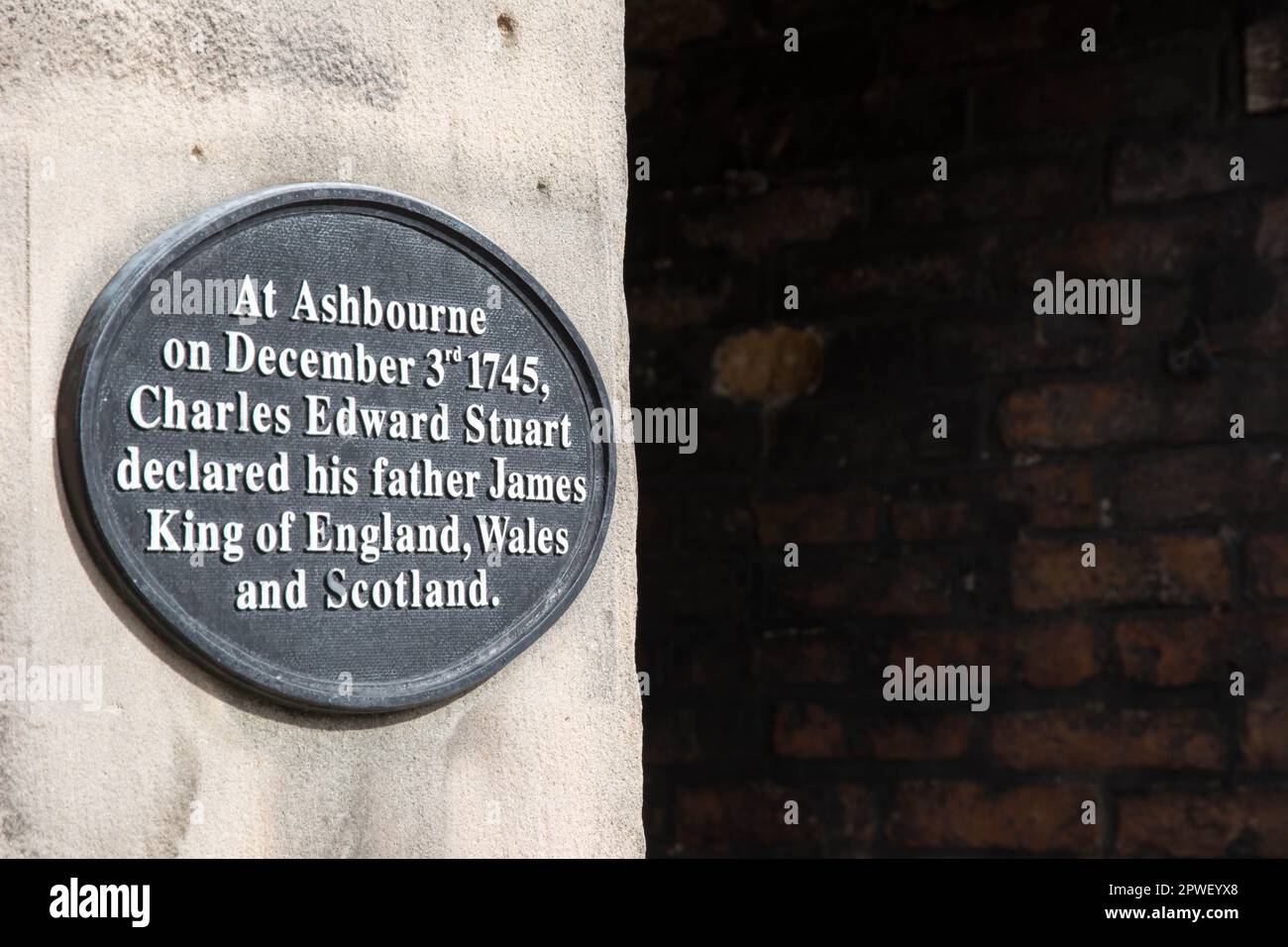 Plaque on wall in Ashbourne, England marking historical event Stock