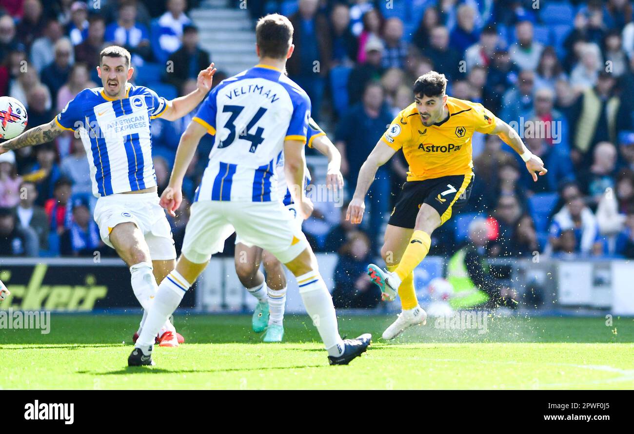 Pedro Neto of Wolves with a shot during the Premier League match between Brighton & Hove Albion and Wolverhampton Wanderers at The American Express Community Stadium , Brighton , UK - 29th April 2023. Photo Simon Dack / Telephoto Images. Editorial use only. No merchandising. For Football images FA and Premier League restrictions apply inc. no internet/mobile usage without FAPL license - for details contact Football Dataco Stock Photo