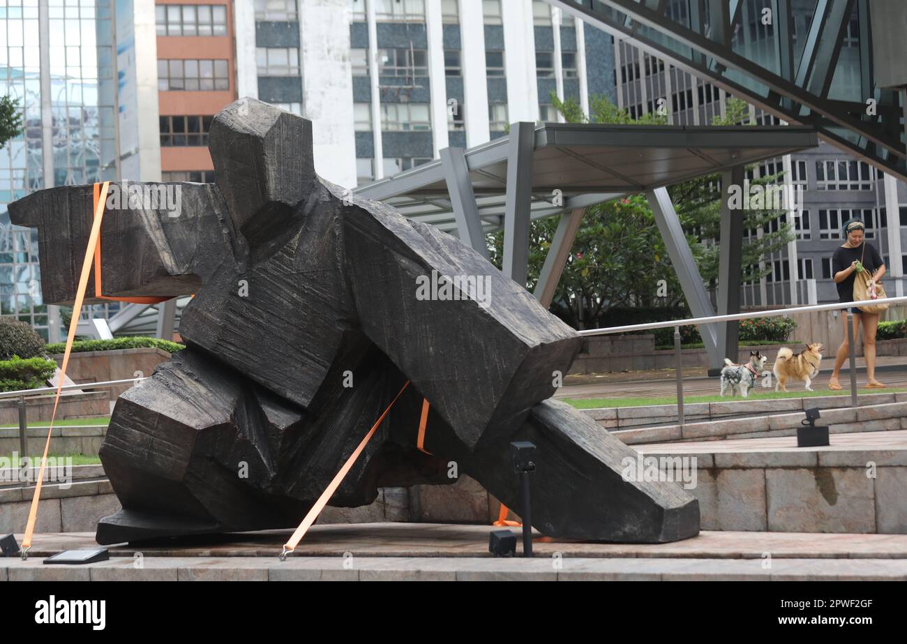 Hong Kong Observatory issued typhoon 8 this morning. A woman takes a ...