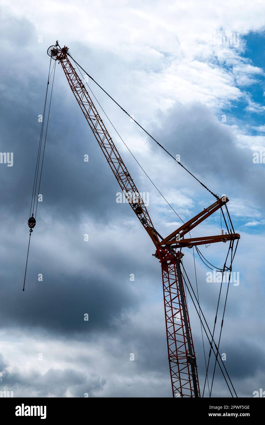 Construction crane with overcast sky Stock Photo