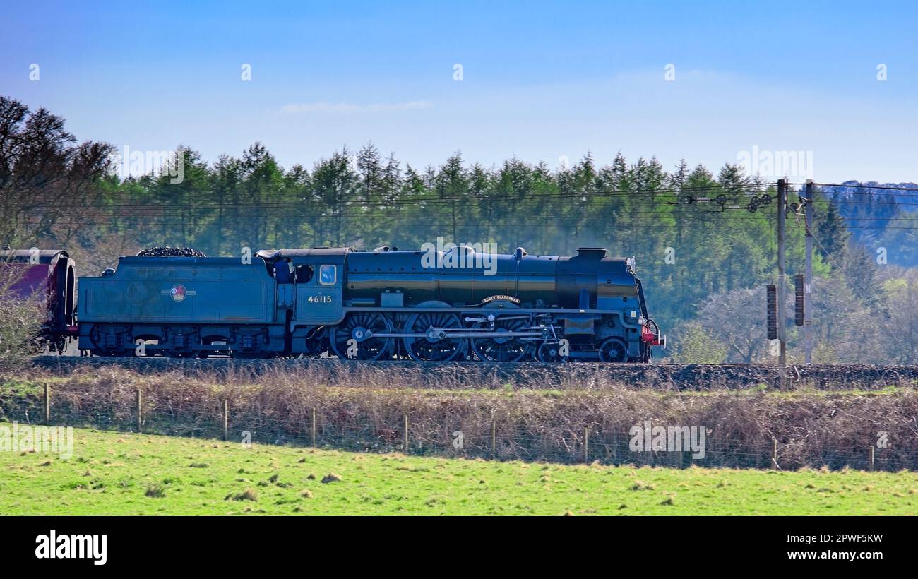 Tundergarth, Scotland - April  18, 2023: The Scots Guardsman vintage steam locomotive traveling towards Lockerbie Scotland Stock Photo