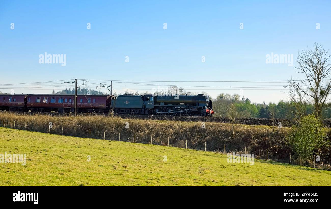 Tundergarth, Scotland - April  18, 2023: The Scots Guardsman vintage steam locomotive traveling towards Lockerbie Scotland Stock Photo