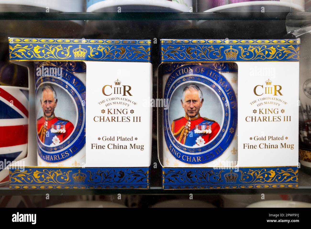 London, UK.  30 April 2023.  Royal memorabilia, including souvenir King Charles mugs bearing the new King's cipher, seen in the window of a souvenir shop in Paddington ahead of the coronation of King Charles III on 6 May.  Credit: Stephen Chung / Alamy Live News Stock Photo