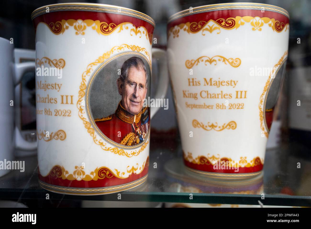 London, UK.  30 April 2023.  Royal memorabilia, including King Charles mugs bearing the date September 8th 2022, the day Queen Elizabeth II died, seen in the window of a souvenir shop in Paddington ahead of the coronation of King Charles III on 6 May.  Credit: Stephen Chung / Alamy Live News Stock Photo