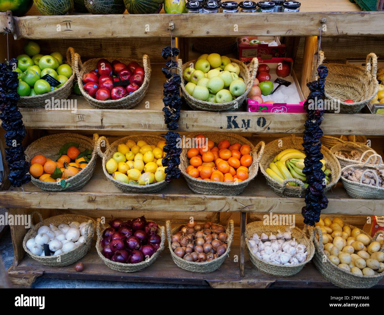 Fruit and veg displayed in attractive baskets outside a village store in Majorca Spain Stock Photo