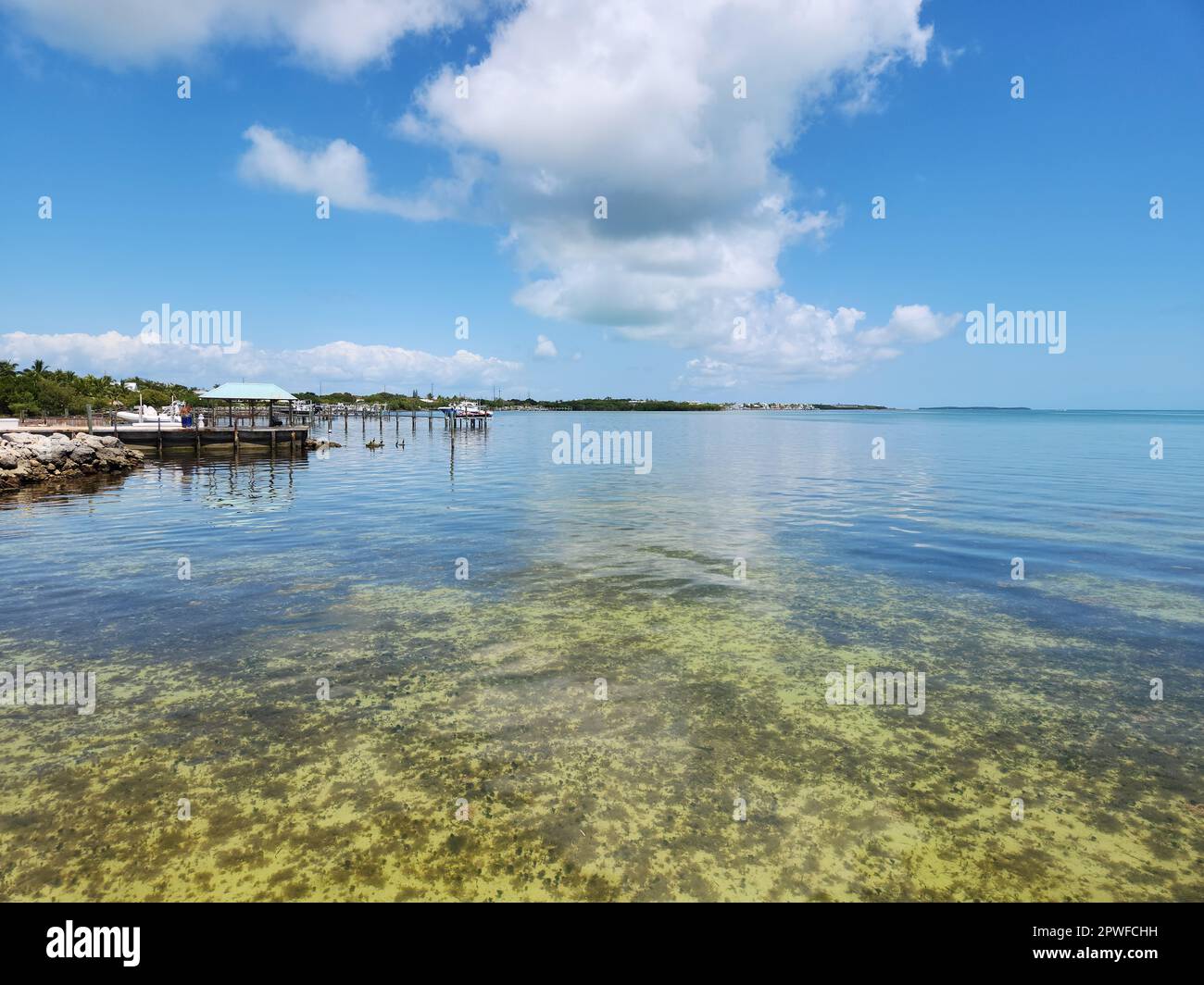 Tavernier, Florida - April 2, 2023 - Waterfront residences and docks on Tavernier Key on caln sunny afternoon. Stock Photo