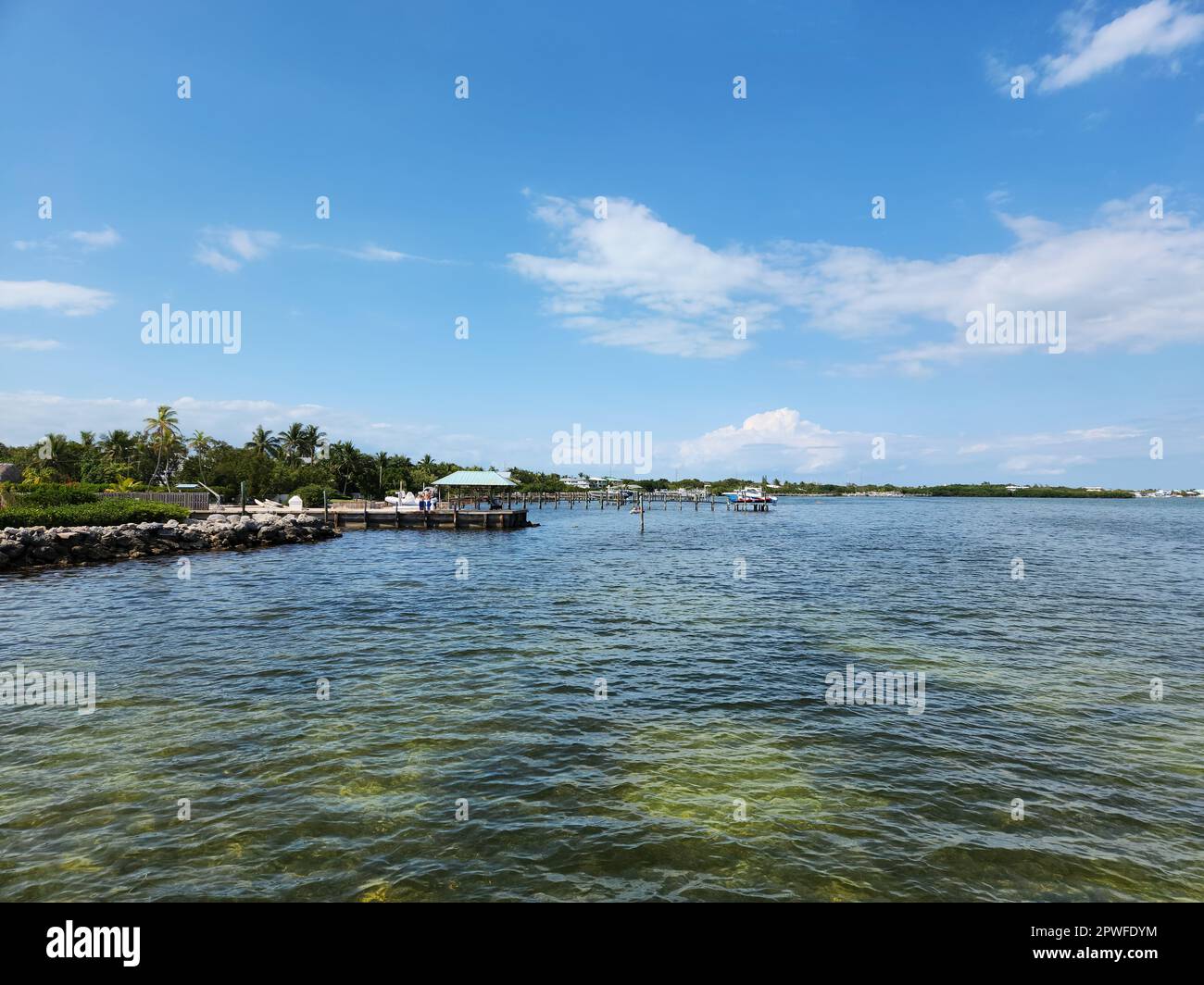 Tavernier, Florida - April 2, 2023 - Waterfront residences and docks on Tavernier Key on caln sunny afternoon. Stock Photo