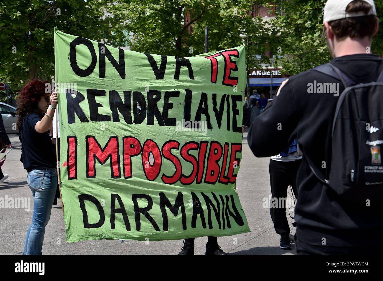 Marseille, France. 29th Apr, 2023. Protesters hold a banner expressing their opinion during the demonstration. Several people mostly the Comorian population, demonstrated in Marseille against the immigration law by the French government of Emmanuel Macron and supported by the Minister of Interior Gérald Darmanin, and against the 'Wuambushu' security operation in Mayotte. (Photo by Gerard Bottino/SOPA Images/Sipa USA) Credit: Sipa USA/Alamy Live News Stock Photo