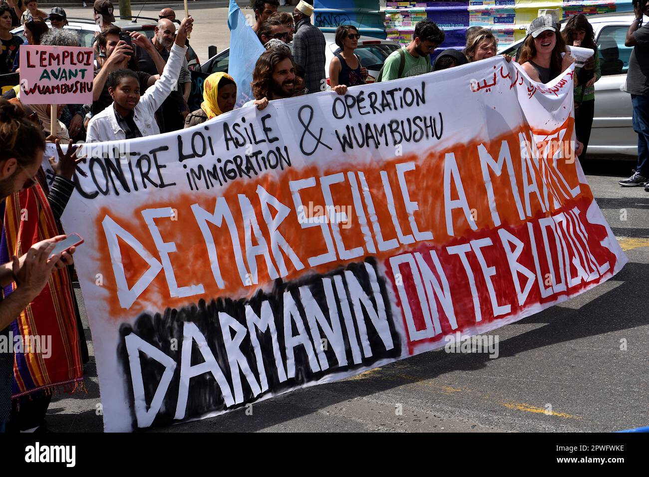 Marseille, France. 29th Apr, 2023. Protesters hold a banner expressing their opinion during the demonstration. Several people mostly the Comorian population, demonstrated in Marseille against the immigration law by the French government of Emmanuel Macron and supported by the Minister of Interior Gérald Darmanin, and against the 'Wuambushu' security operation in Mayotte. (Photo by Gerard Bottino/SOPA Images/Sipa USA) Credit: Sipa USA/Alamy Live News Stock Photo