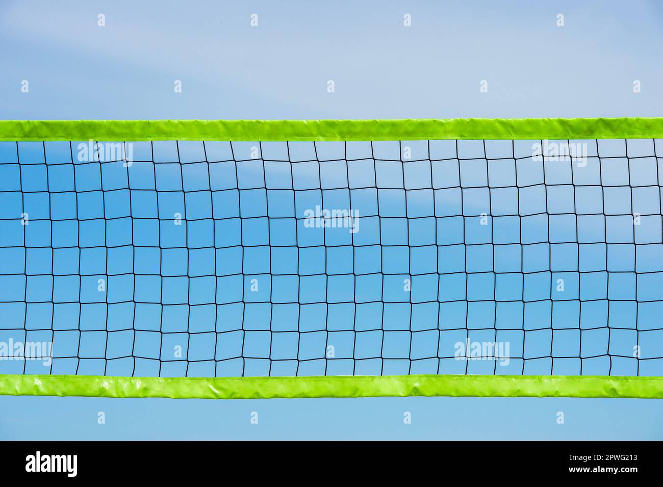 Beach volleyball and beach tennis net on blue sky background. Summer sport concept. Horizontal