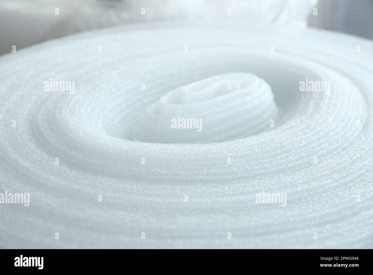 Polyethylene foam roll, closeup view. Packaging material Stock Photo ...