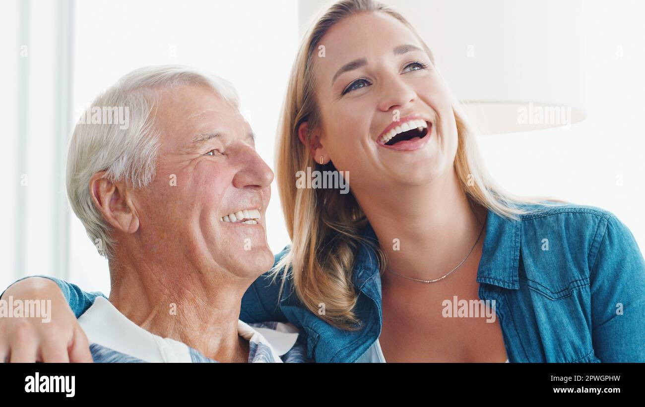The light of each others lives. a young woman spending quality time with her father at home. Stock Photo
