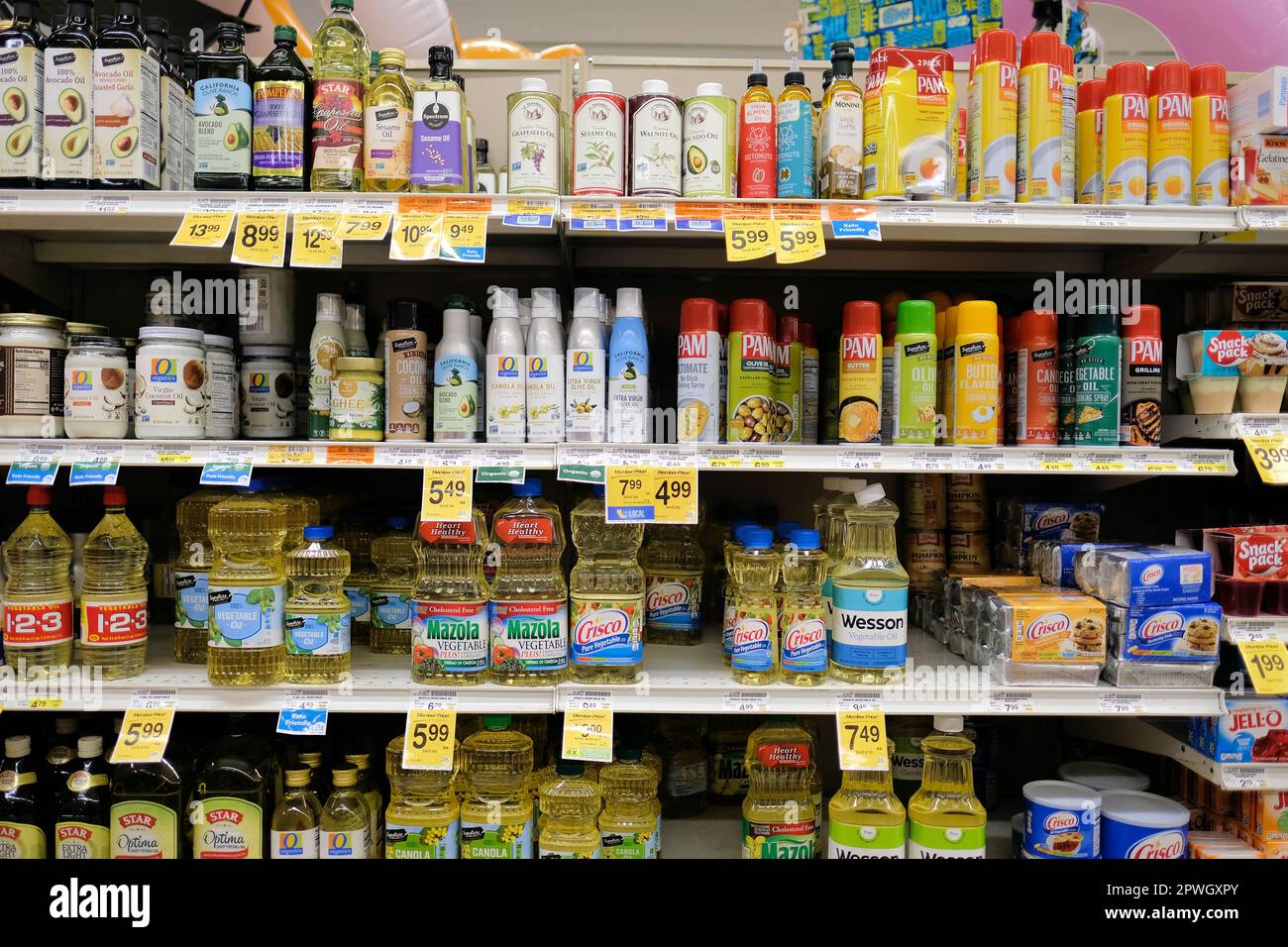 Cooking oil shelves at a Safeway grocery store with Mazola, Crisco, Wesson, Pam and Signature brands; vegetable, canola oils, cooking sprays. Stock Photo