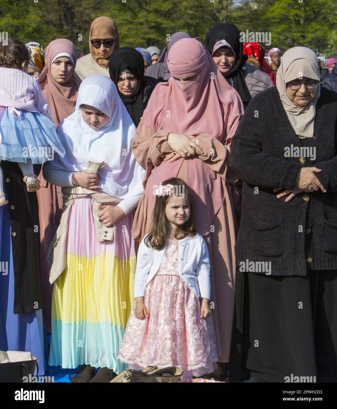 Muslims from various mosques in Brooklyn attend a prayer service on Eid at the end of Ramadan in Prospect Park, Brooklyn, New York. Stock Photo