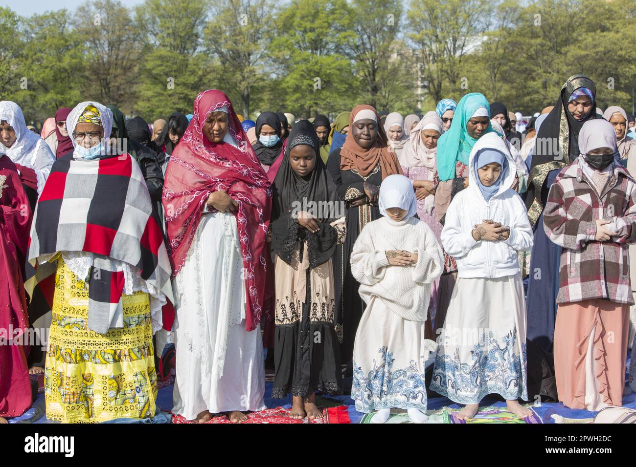 Muslims from various mosques in Brooklyn attend a prayer service on Eid at the end of Ramadan in Prospect Park, Brooklyn, New York. Stock Photo