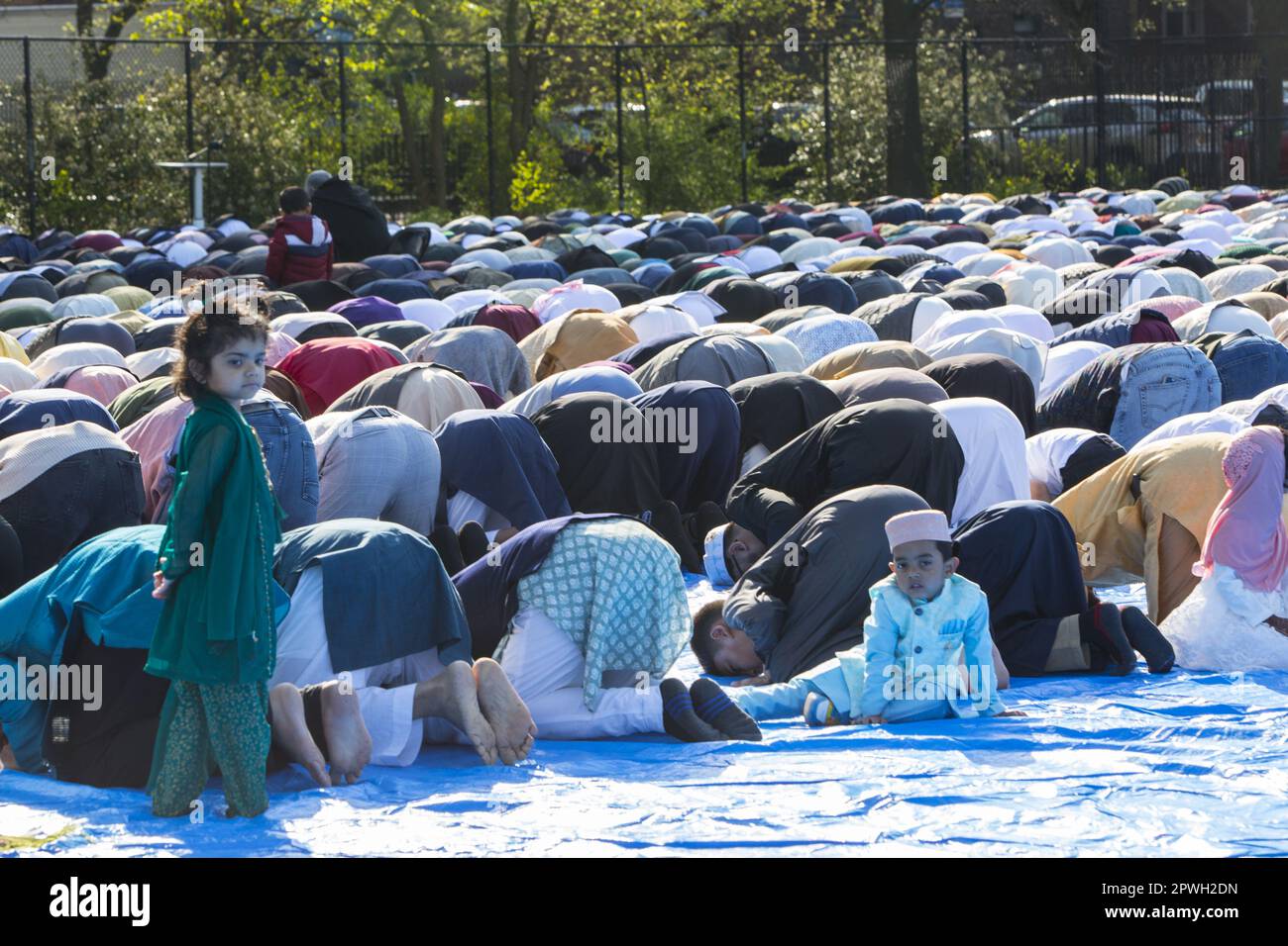 Muslims from various mosques in Brooklyn attend a prayer service on Eid at the end of Ramadan in Prospect Park, Brooklyn, New York. Stock Photo