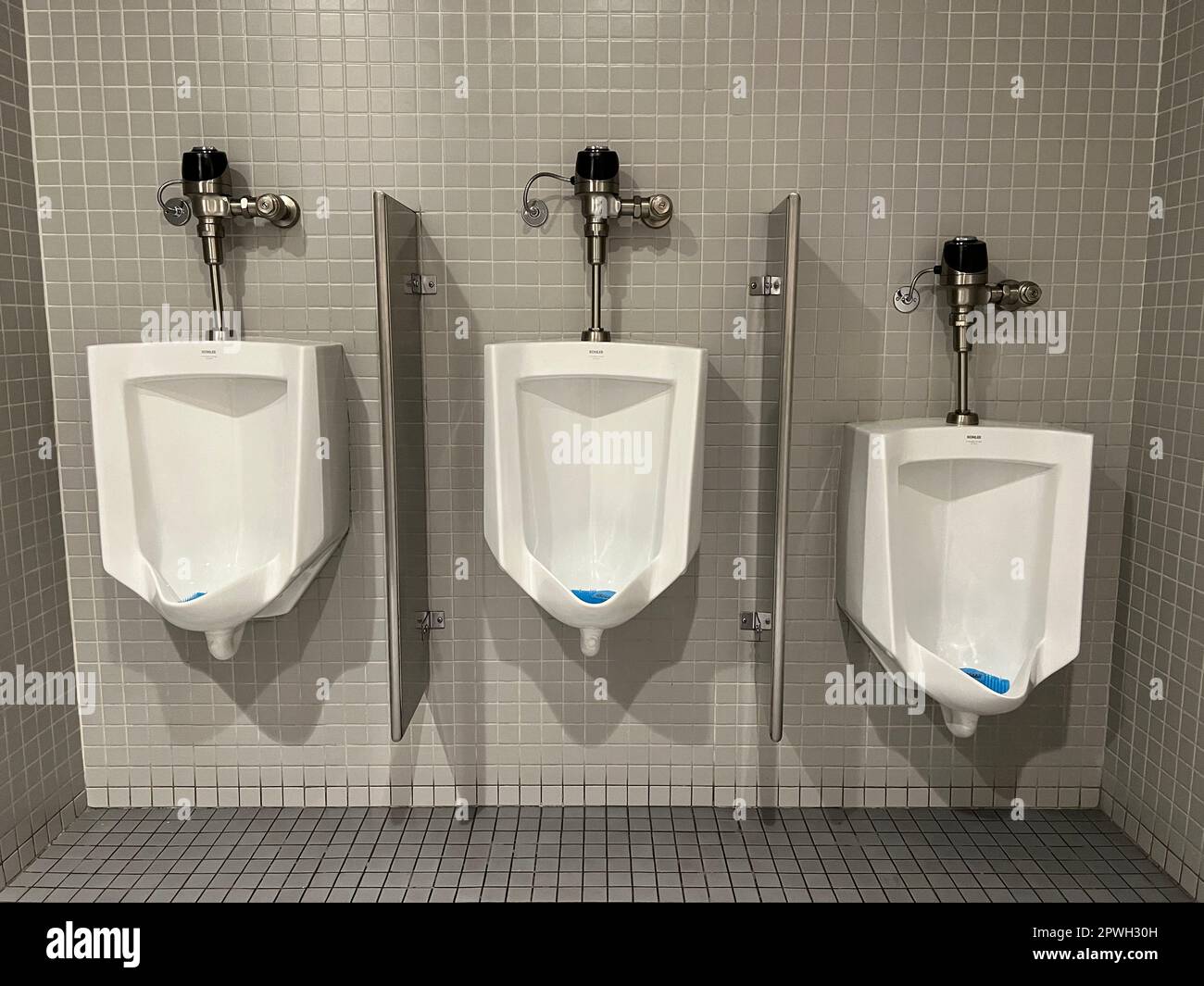 Ode to Marcel Duchamp. Urinals, mens bathroom, Whitney Museum, NYC. Stock Photo
