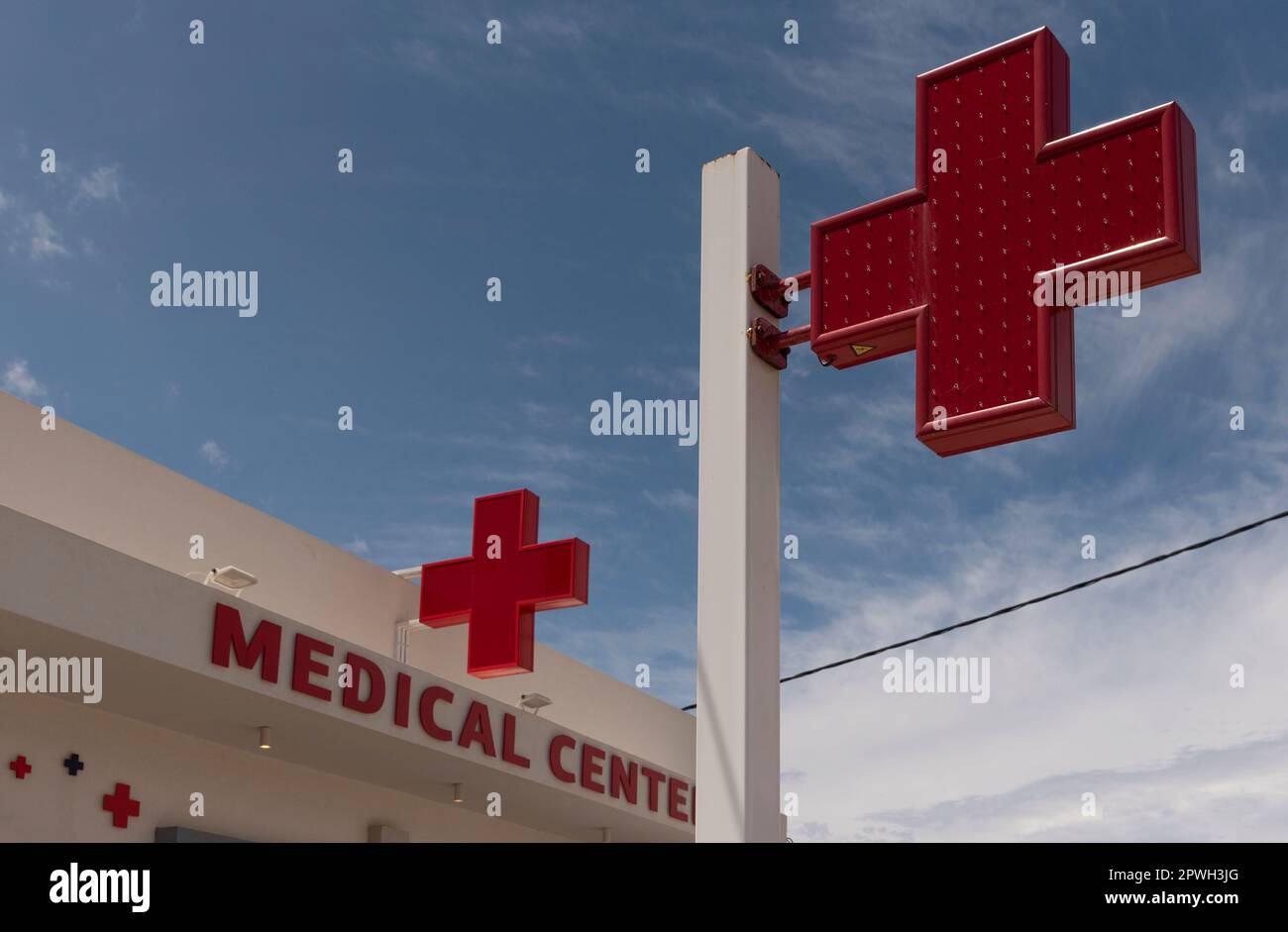 Crete, Greece, EU. 2023. Red cross on display outside a medical centre in Crete, Greece. Stock Photo