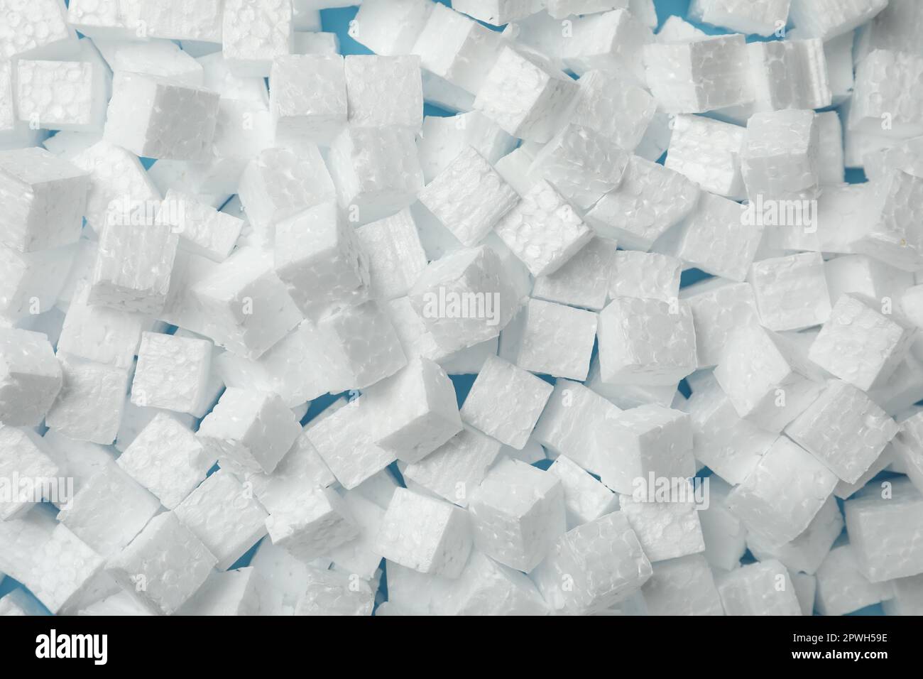 Many styrofoam cubes on light blue background, top view Stock Photo