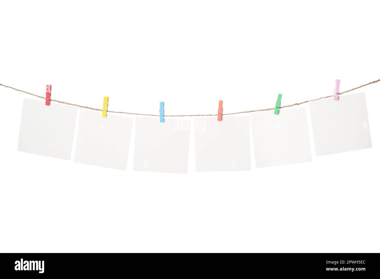 Clothespins with empty notepapers on string against white background. Space for text Stock Photo