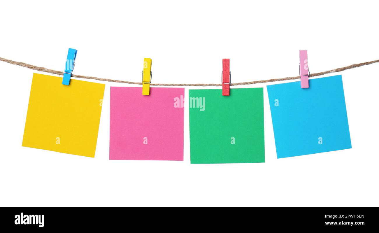 Clothespins with empty notepapers on string against white background. Space for text Stock Photo