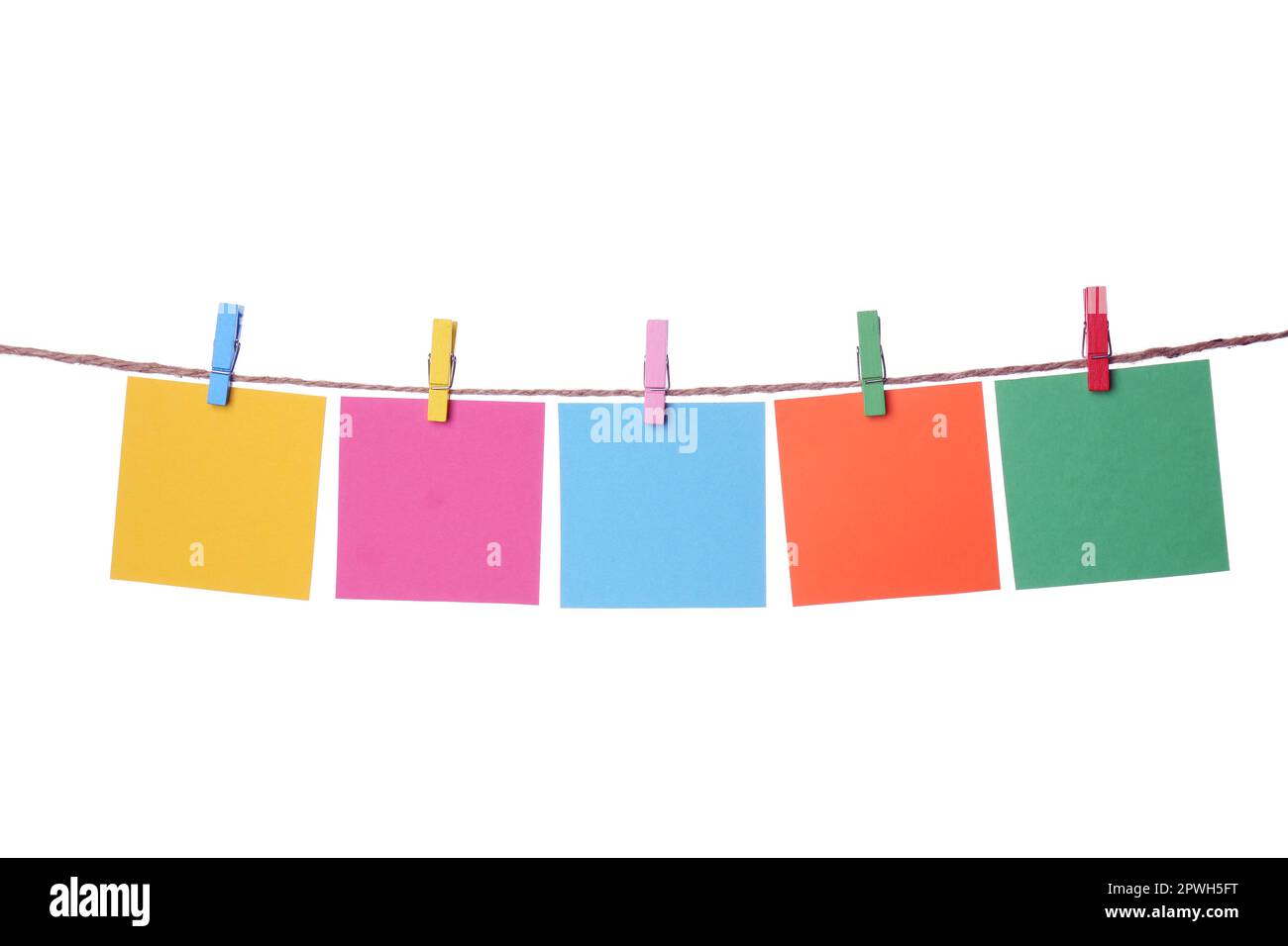 Clothespins with empty notepapers on string against white background. Space for text Stock Photo