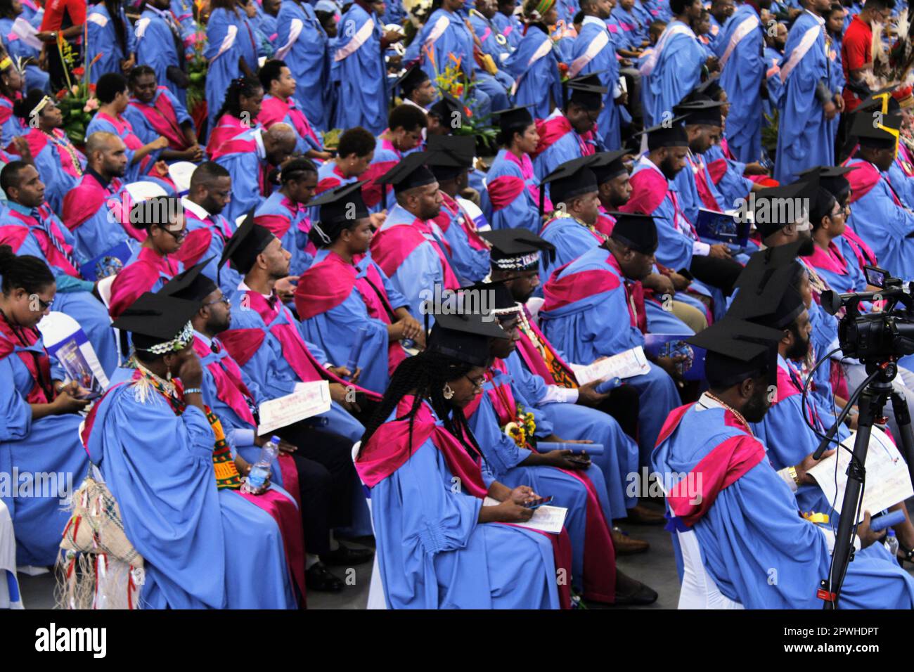 Graduating post-graduate students from the University of Papua New Guinea's (UPNG) School of Medicine and Health Sciences (SMHS) listening to speakers. Stock Photo