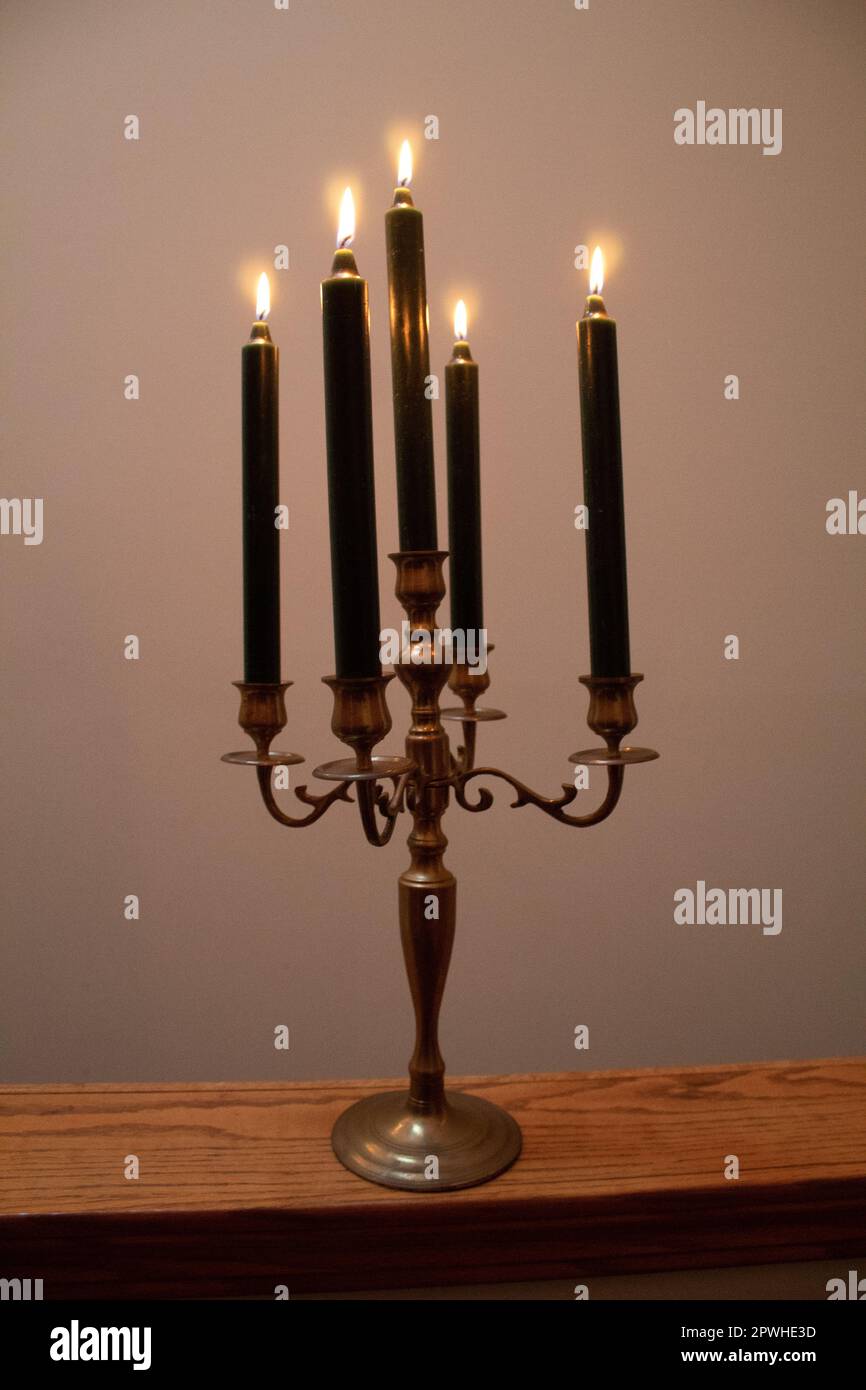 Lit candles in a candelabra Stock Photo Alamy