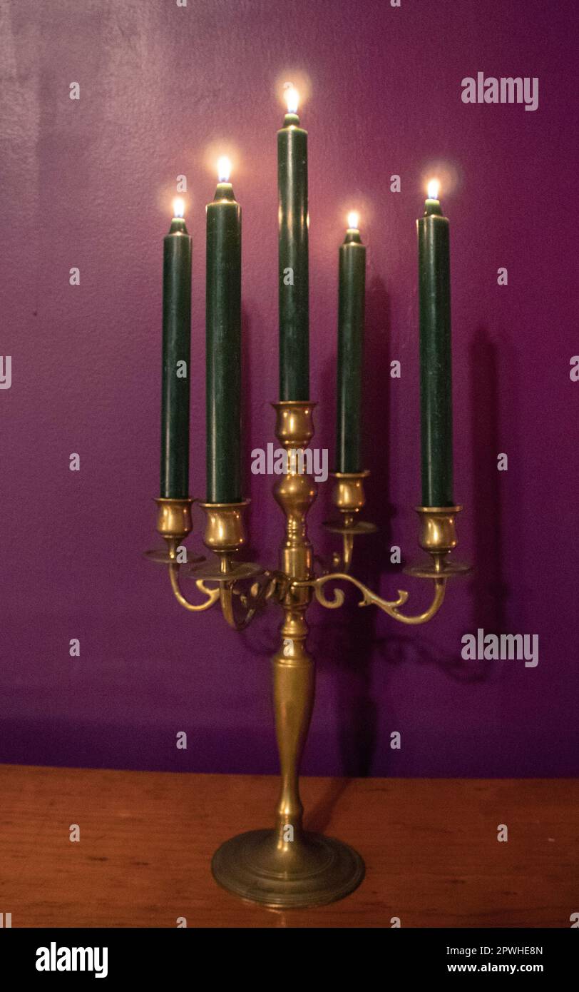 Lit candles in a candelabra Stock Photo Alamy