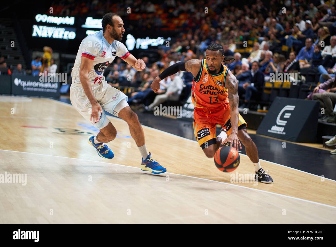 Valencia, Spain. 29th Apr, 2023. Phil Scrubb of Monbus Obradoiro (L) and Shannoon Evans of Valencia basket (R) in action during the Endesa League Regular Season Round 30 between Valencia and Monbus Obradoiro at Fuente de San Luis Sport Hall. Valencia Basket 87:78 Monbus Obradoiro Credit: SOPA Images Limited/Alamy Live News Stock Photo