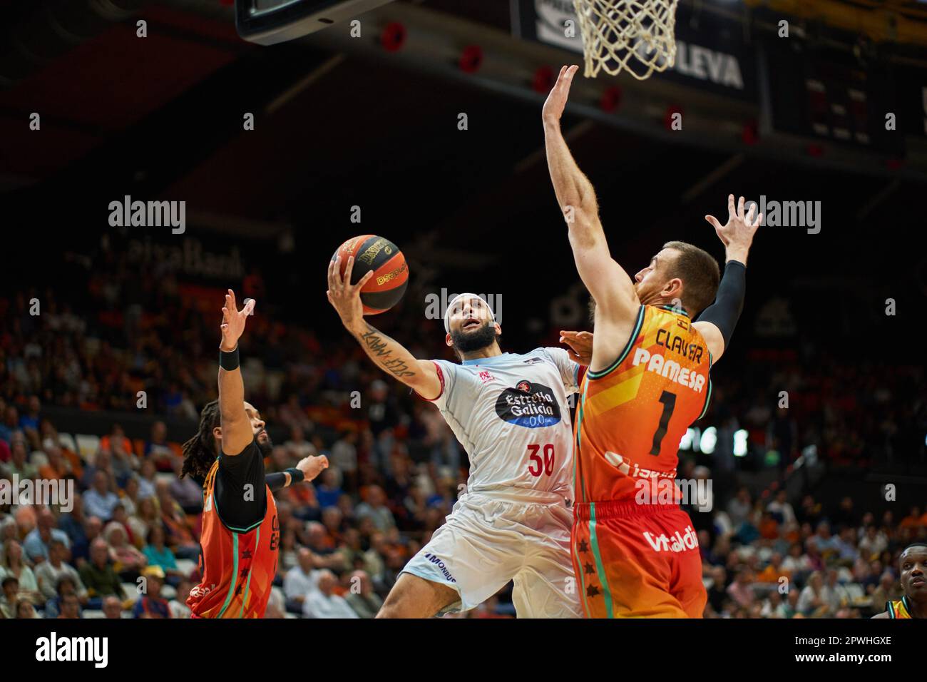Valencia, Spain. 29th Apr, 2023. Kassius Robertson of Monbus Obradoiro (L)  and Victor Claver of Valencia basket (R) in action during the Endesa League  Regular Season Round 30 between Valencia and Monbus