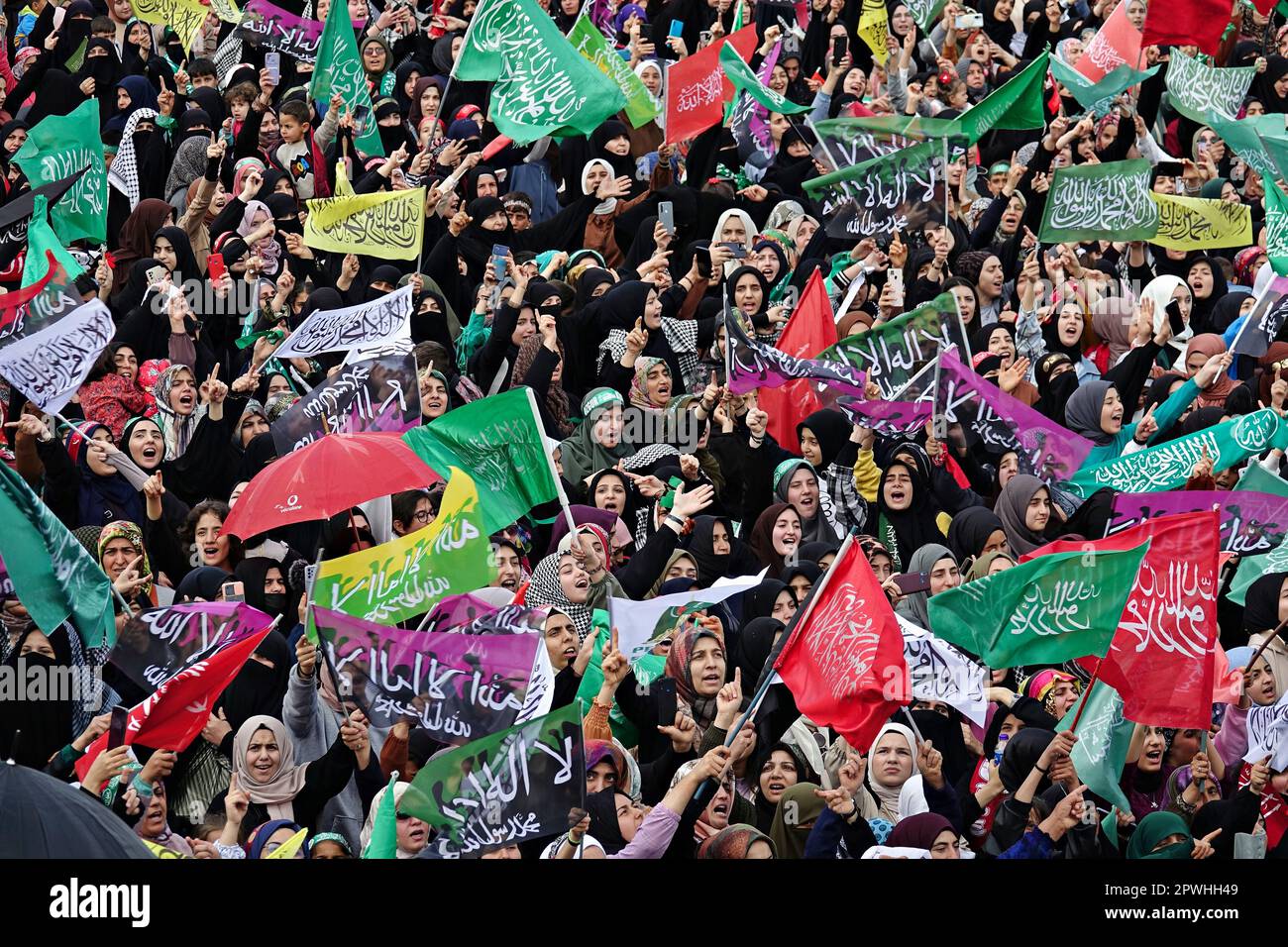 Participants of the birthday event of the Islamic Prophet Muhammad, held at Newroz Park are seen waving flags. The birth of the Islamic Prophet Muhammad was celebrated with an event organized by the Prophet Lovers Foundation in Newroz square in Diyarbakir and attended by thousands of people. Zekeriya Yapicioglu, the Chairman of the Islamic Kurdish party Free Cause Party (HUDA-PAR), as well as representatives of many parties and organizations from different Muslim countries, especially the representative of the Hamas organization from Palestine, also attended the celebration. (Photo by Mehmet M Stock Photo