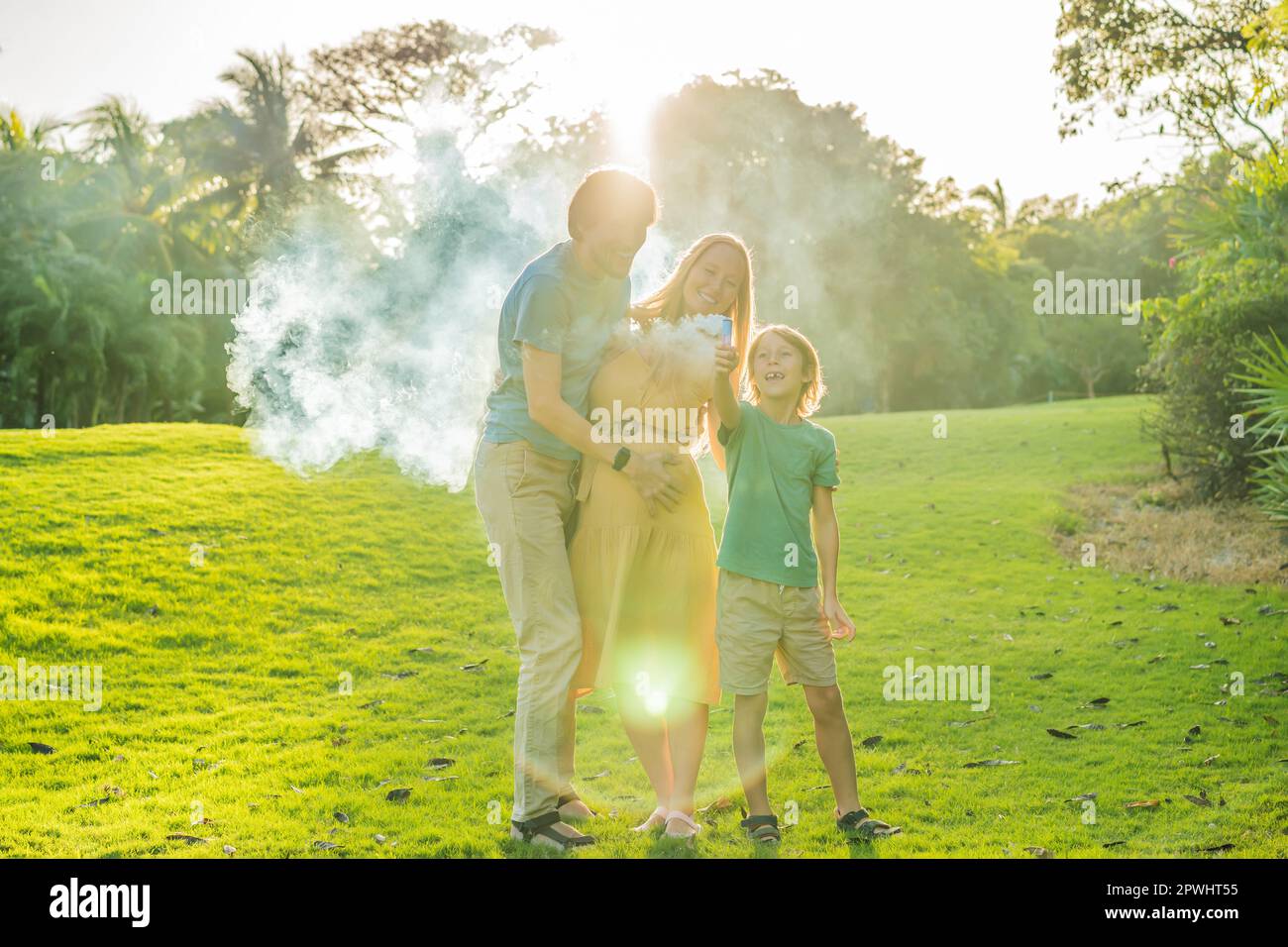Pregnant mom, dad and son at the gender party on the golf course ...