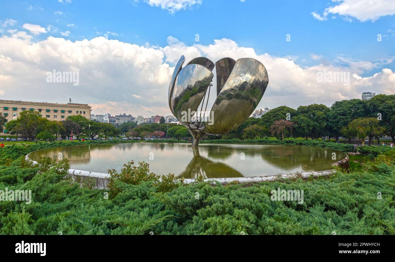Floralis Generica Steel and Aluminium Large Flower Sculpture above a Reflecting Pool in Plaza de las Naciones Unidas City Park, Buenos Aires Argentina Stock Photo