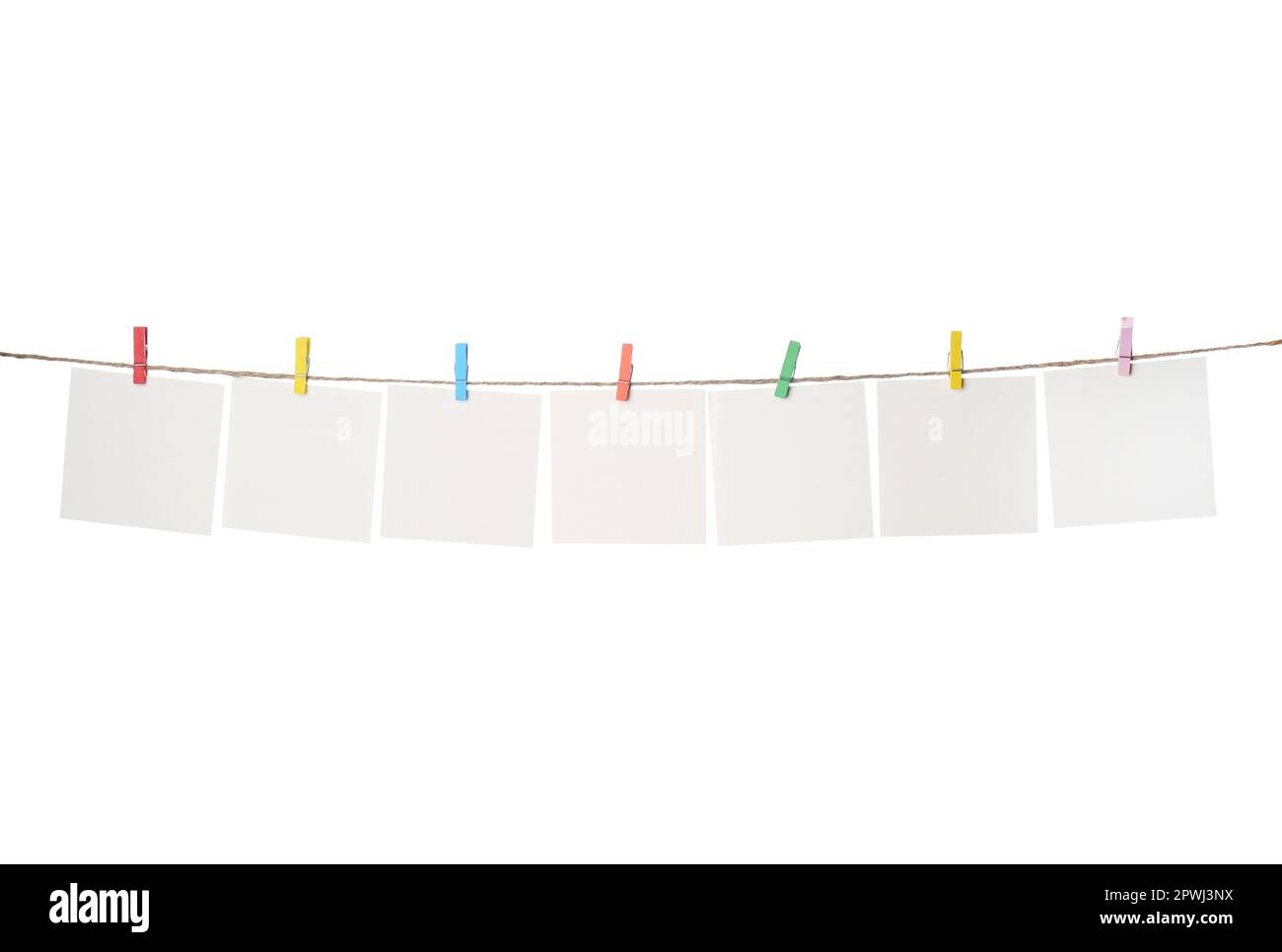 Clothespins with empty notepapers on string against white background. Space for text Stock Photo