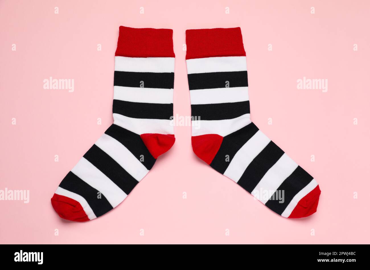 Striped socks on pink background, flat lay Stock Photo