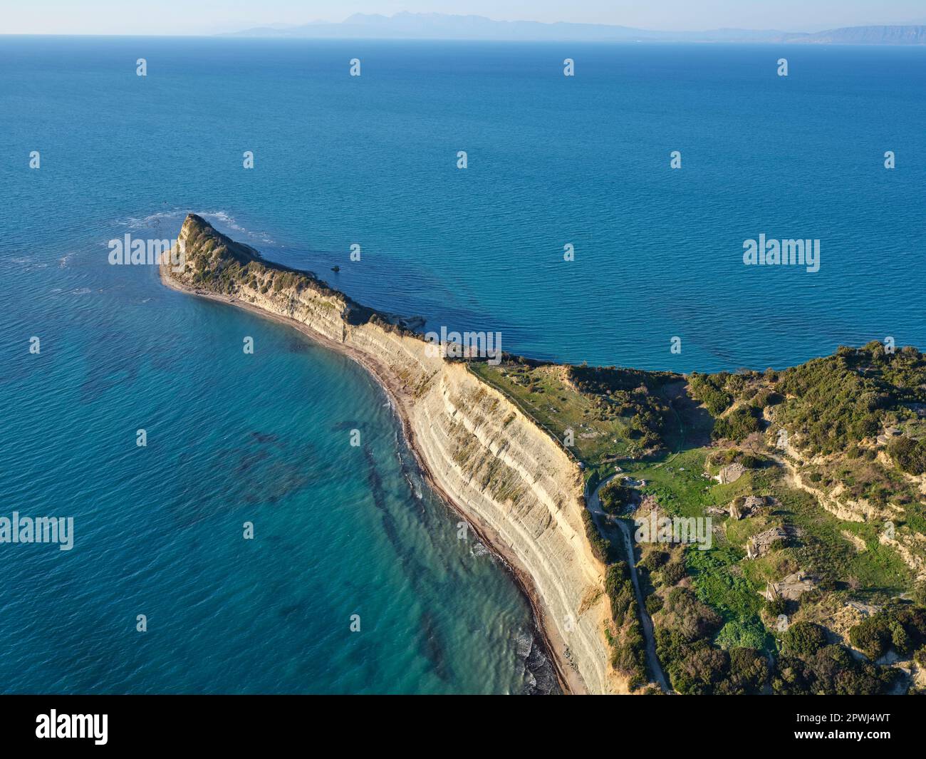 AERIAL VIEW. Cape of Rodon jutting out into the Adriatic Sea, 4 bunkers in the lower right. Durrës County, Albania. Stock Photo