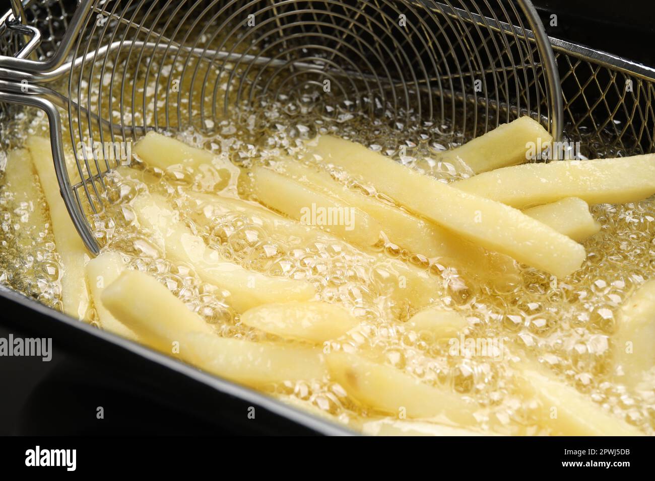 Cooking Delicious French Fries In Hot Oil Closeup Stock Photo Alamy   Cooking Delicious French Fries In Hot Oil Closeup 2PWJ5DB 